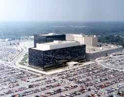 The NSA building from a distance, shown with parking lots surrounding it. 