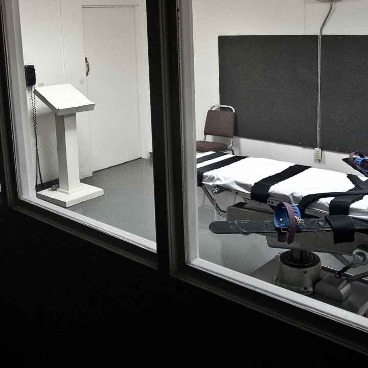 Empty lethal injection execution chamber with injection table and podium